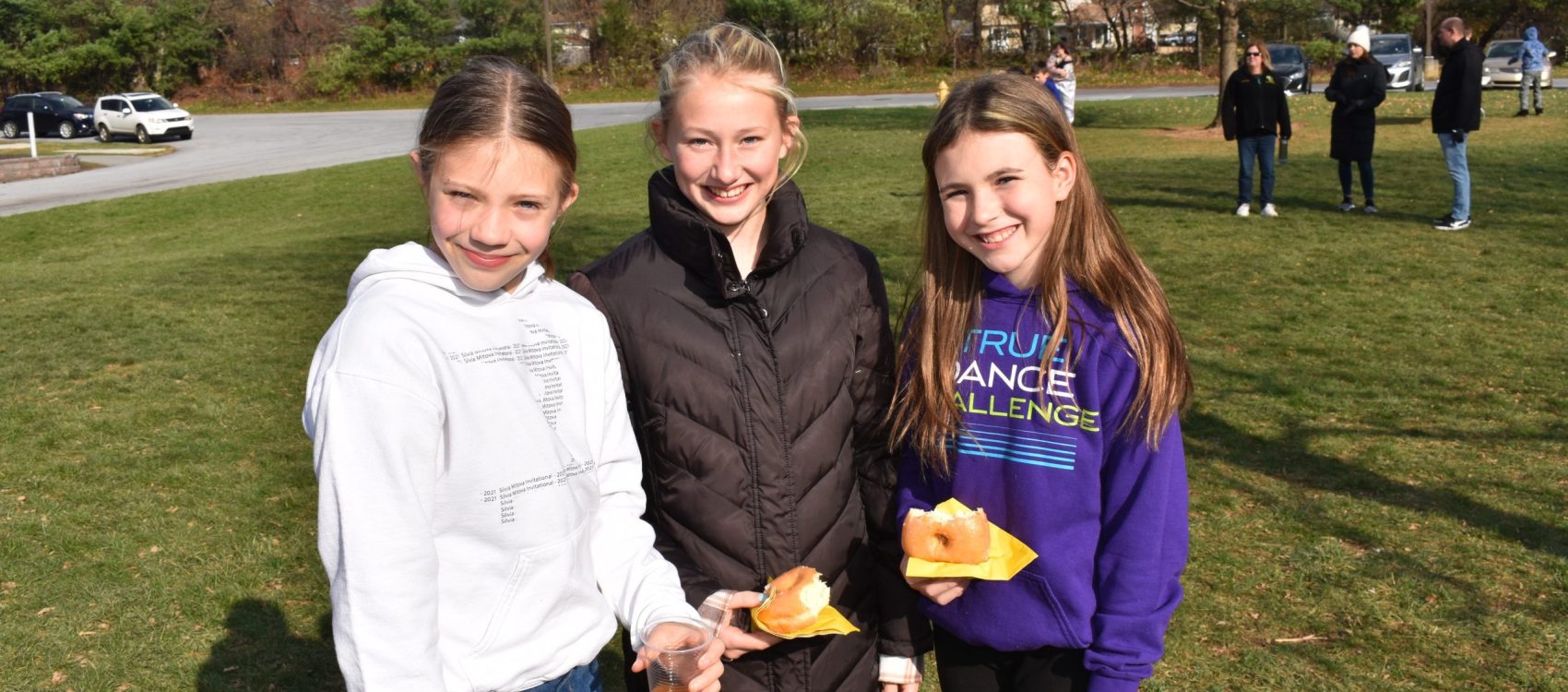 Middle school students taking a picture outside