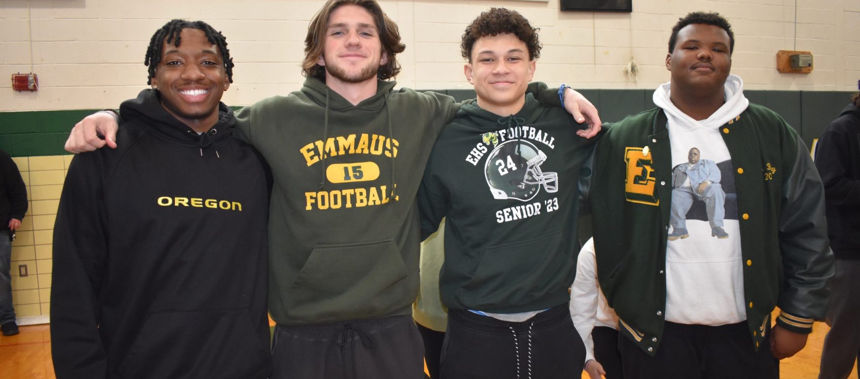 High School Boys taking a picture in the gym