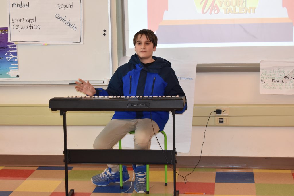 Student playing the piano at the Willow Lane 5th grade talent show