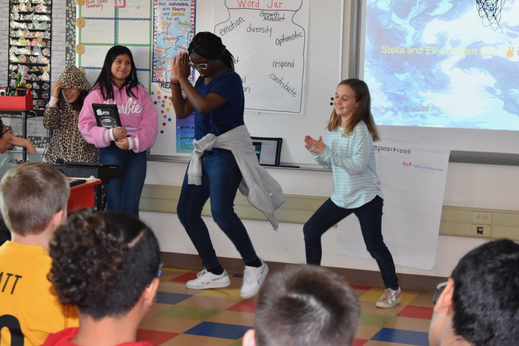 Students doing a dance at the Willow Lane 5th grade talent show