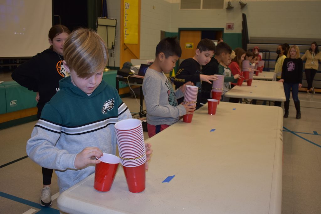 Students playing a game with red plastic cups inaugural Minute to Win it games 