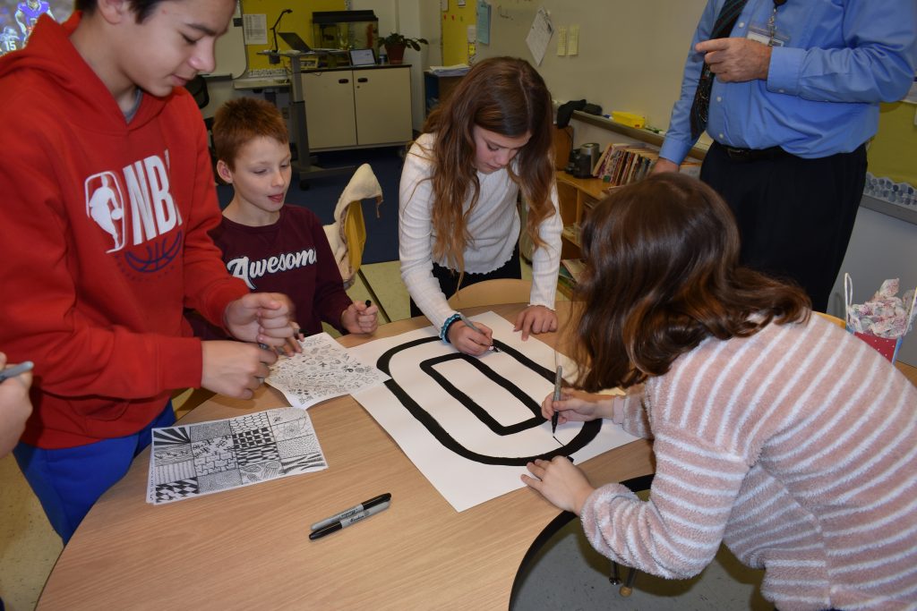 Students gathered together at a table